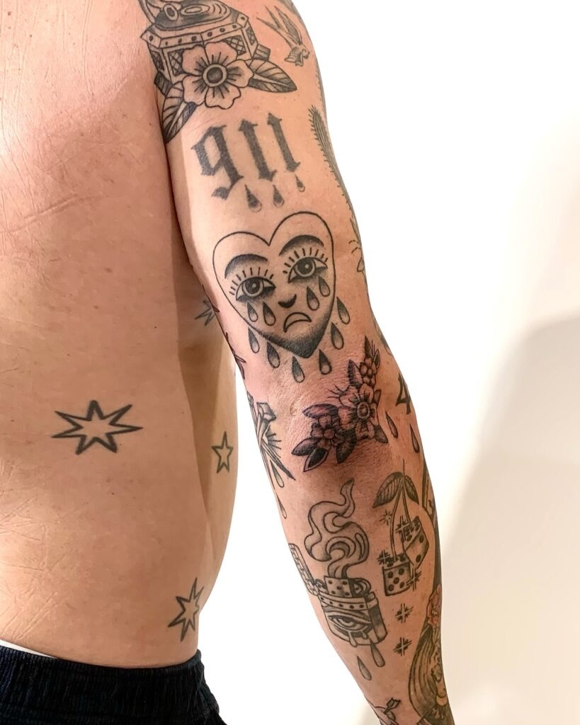 Bold Traditional-Inspired Patchwork Tattoo Sleeve Tattoo Design