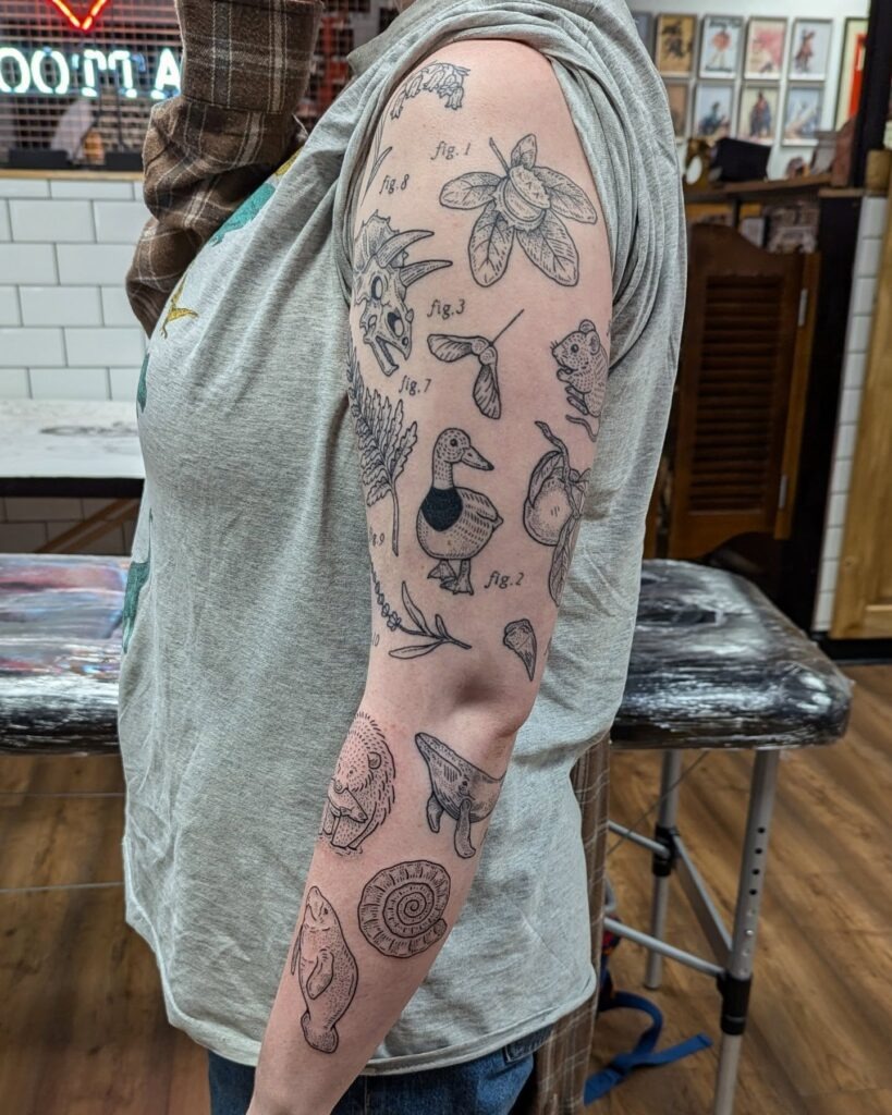 Nature-Inspired Scientific Patchwork Sleeve Tattoo Tattoo Design