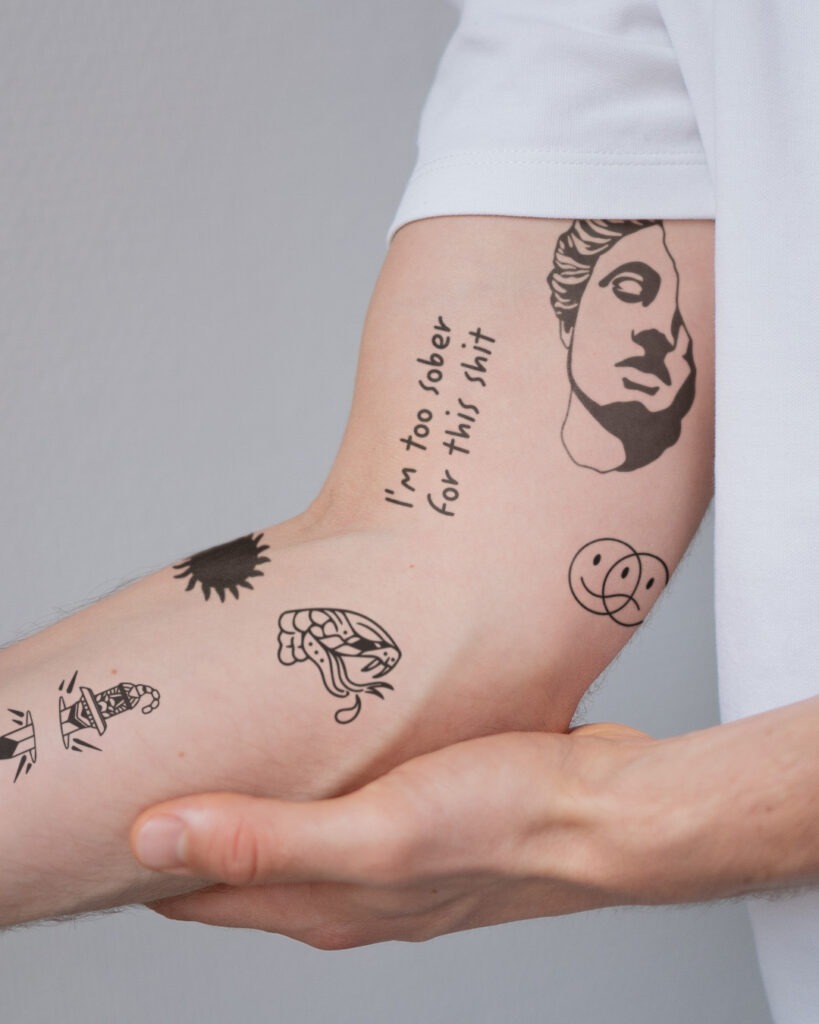 Witty and Bold Patchwork Arm Tattoo Tattoo Design