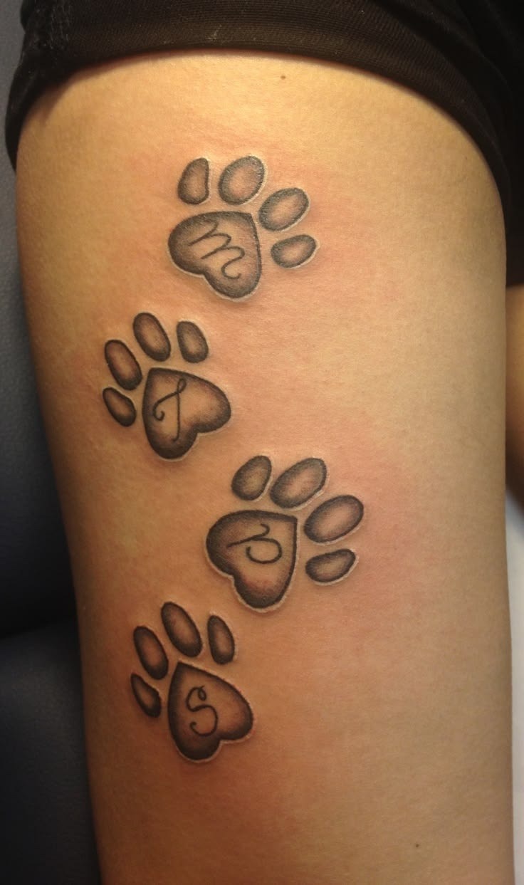 Four Personalized Paw Prints with Initials Tattoo Design