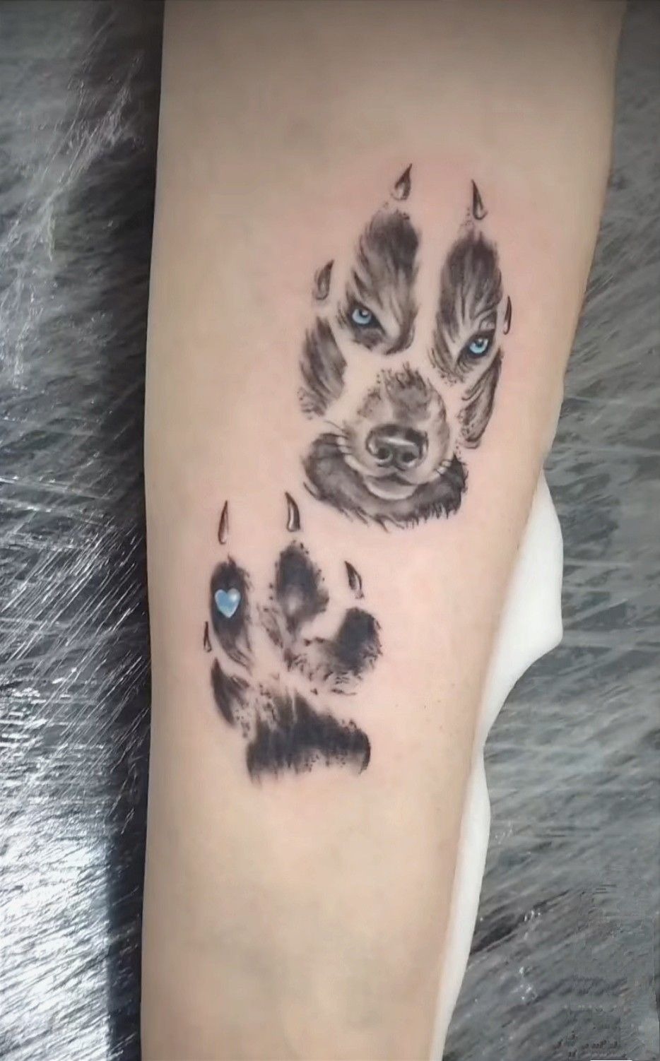 Husky Face Inside Paw Prints Tattoo Design