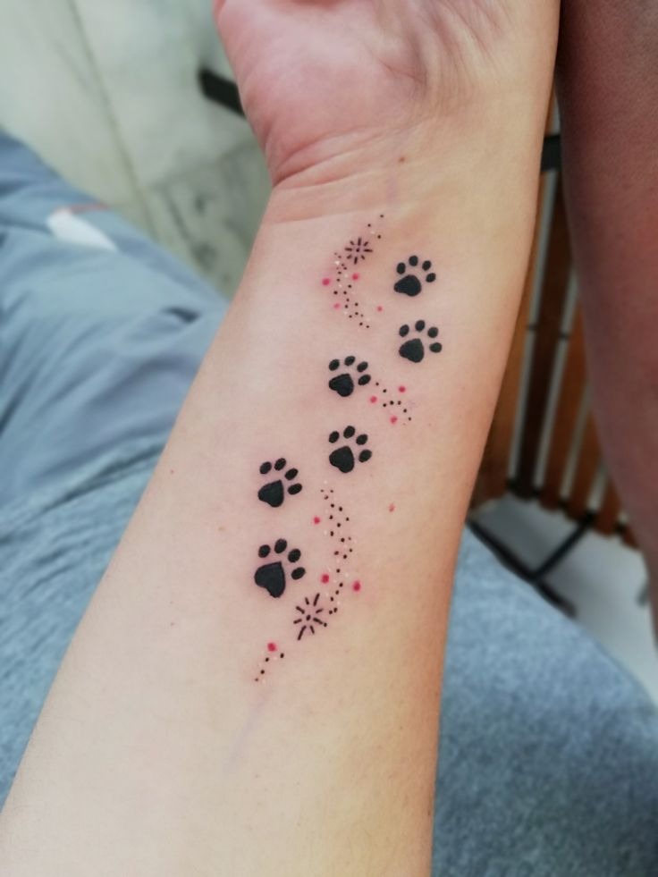 Tiny Paw Trail with Sparkling Details Tattoo Design