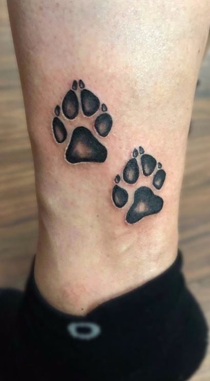 Two Realistic Paw Prints on the Ankle Tattoo Design