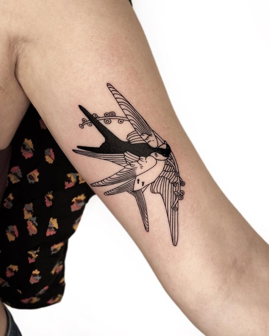 Artistic swallow tattoo representing freedom and peace Tattoo Design