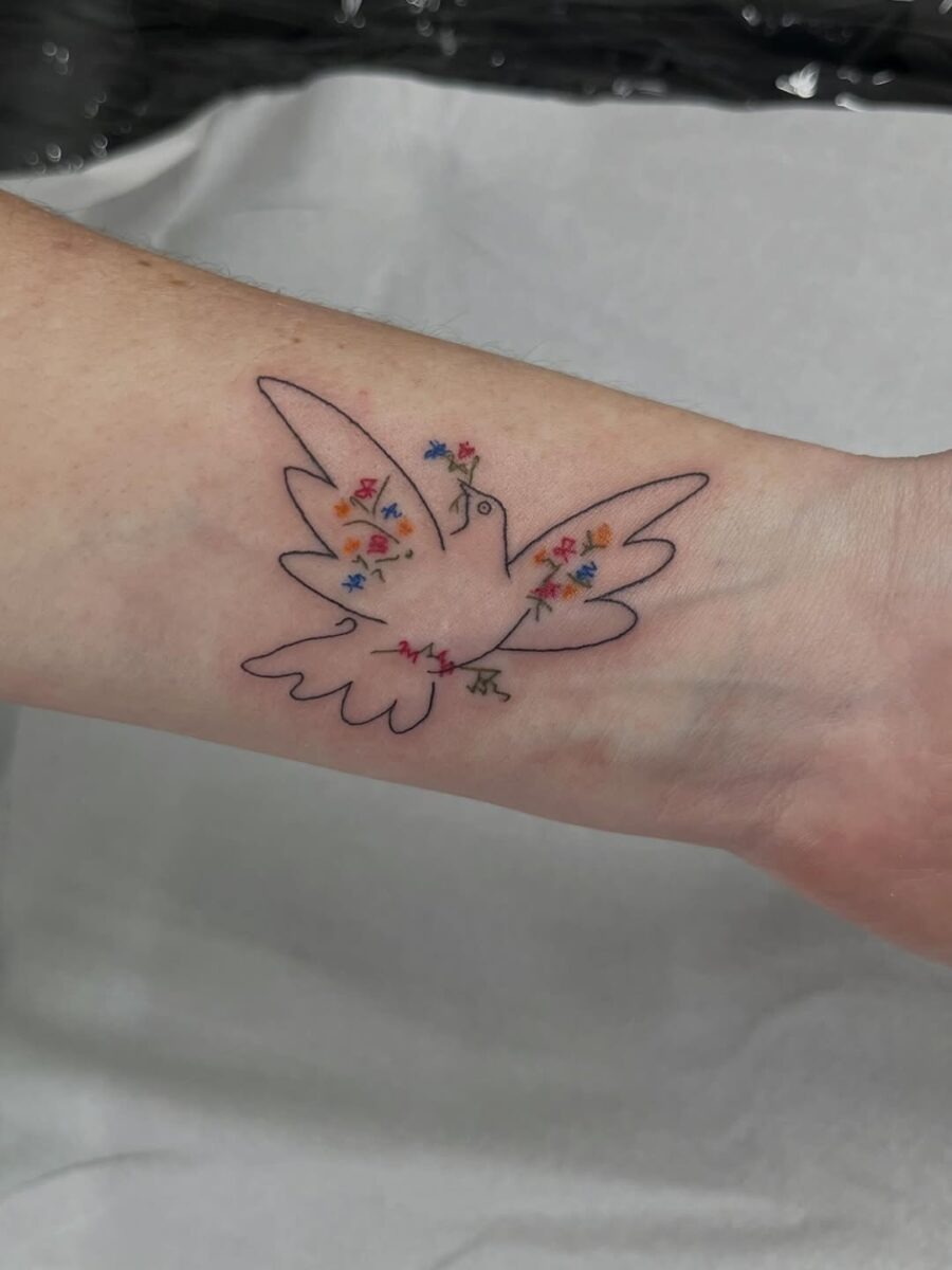 Colorful dove tattoo symbolizing peace and harmony Tattoo Design