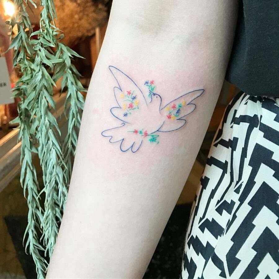 Delicate dove surrounded by colorful flowers Tattoo Design