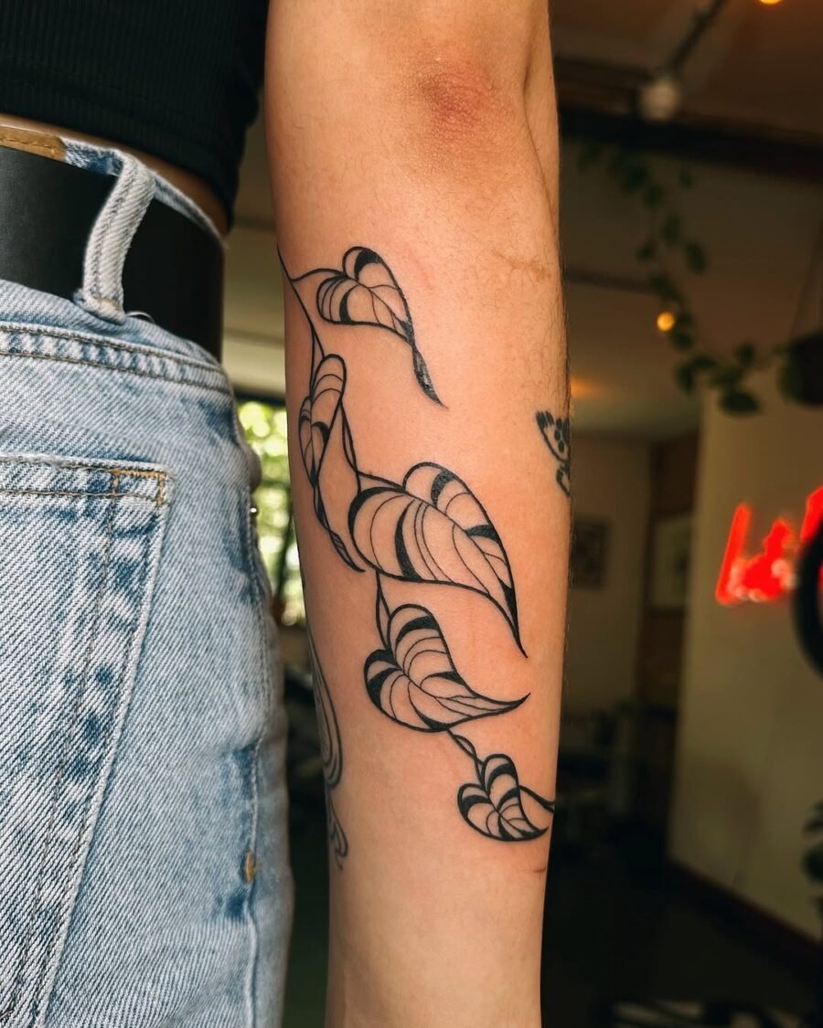 Elegant floral peace tattoo design on arm Tattoo Design