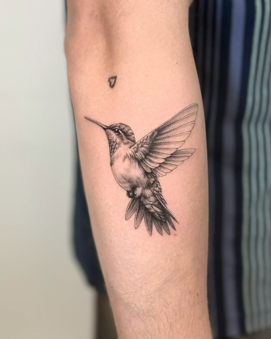 Elegant hummingbird tattoo symbolizing peace and freedom Tattoo Design