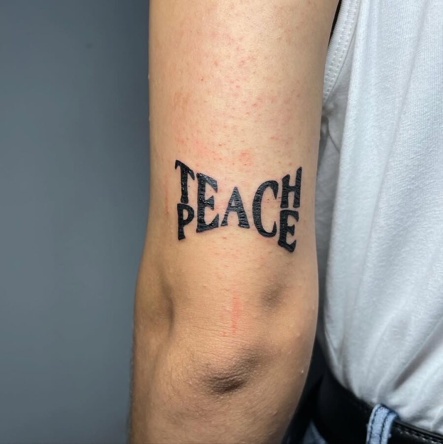 Unique Peace Tattoo with a Teaching Twist Tattoo Design