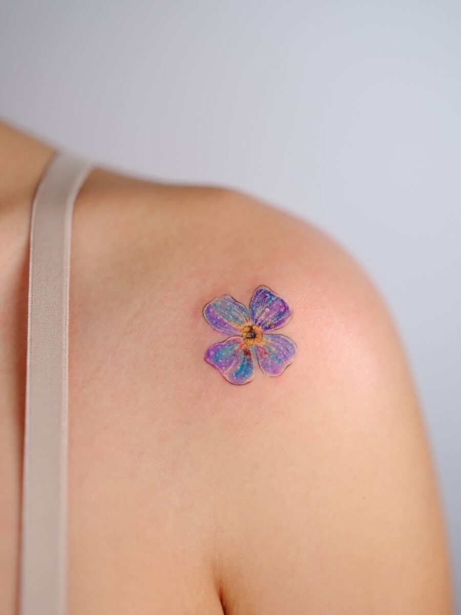 Vibrant floral tattoo exuding tranquility and charm Tattoo Design