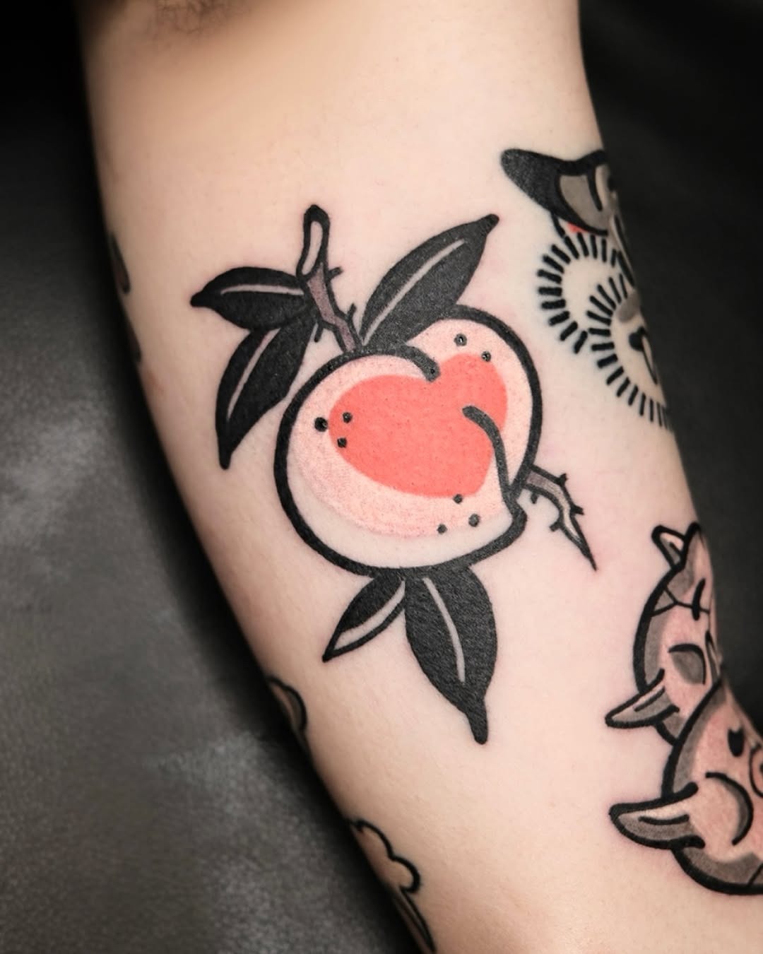 Bright peach tattoo with leafy details Tattoo Design