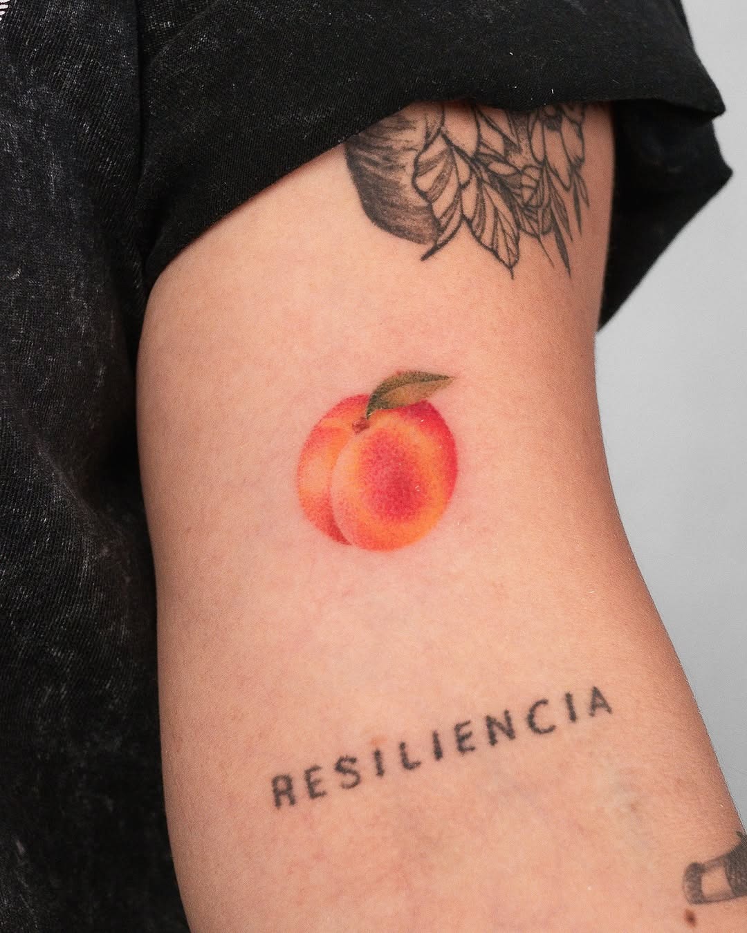 Colorful peach tattoo symbolizing resilience and beauty Tattoo Design