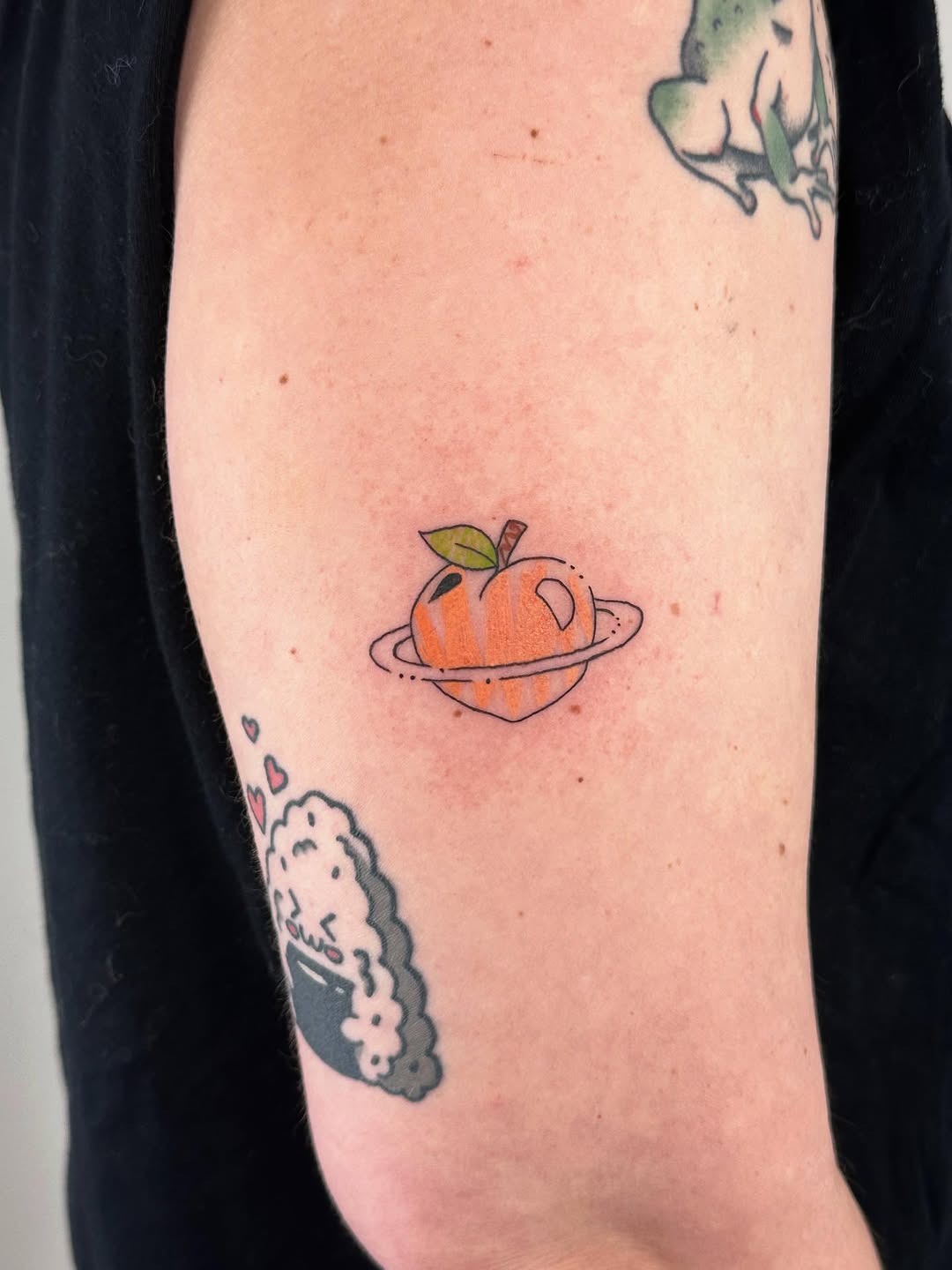 Creative Peach Tattoo with a Cosmic Twist Tattoo Design