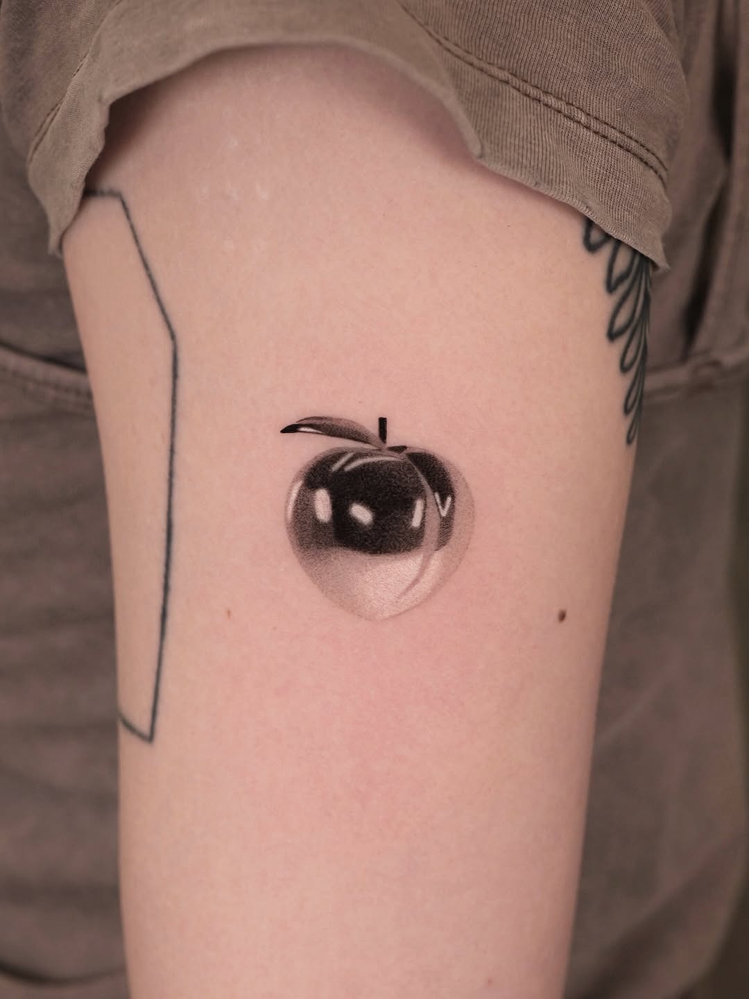 Stylish peach tattoo with a reflective vibe Tattoo Design