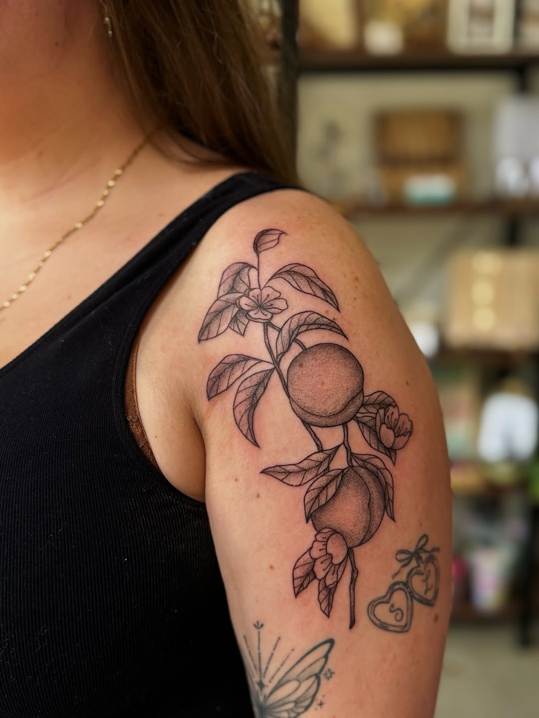 Stylish peach tattoo with floral details Tattoo Design