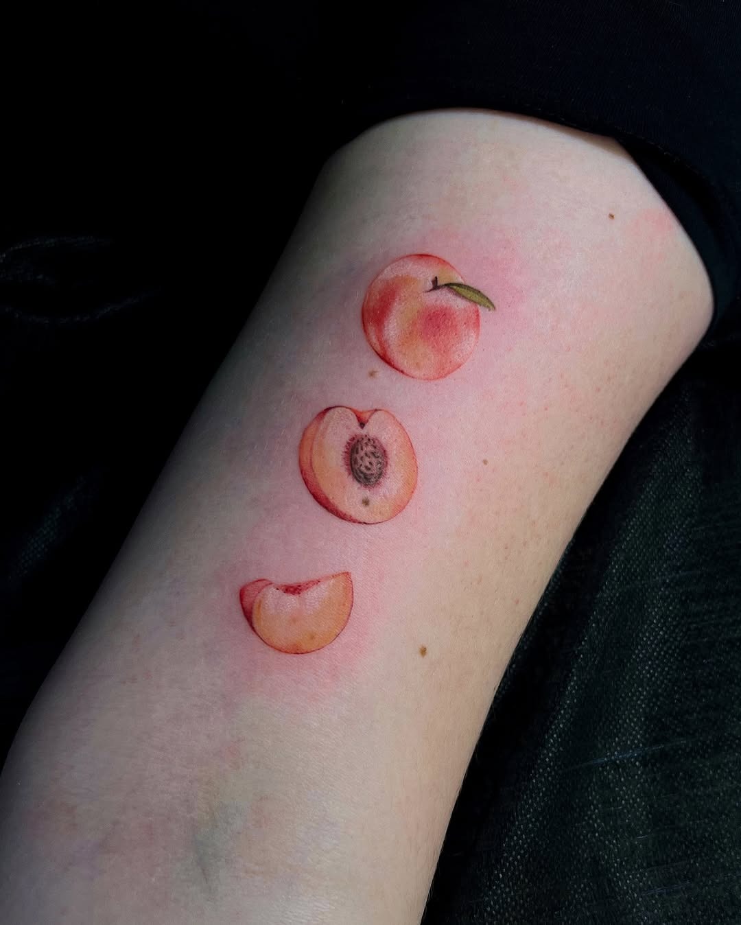 Three Vibrant Peach Tattoos on Display Tattoo Design
