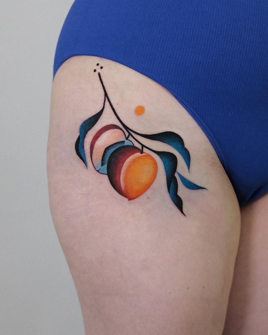 Vibrant peach tattoo with artistic leaves Tattoo Design