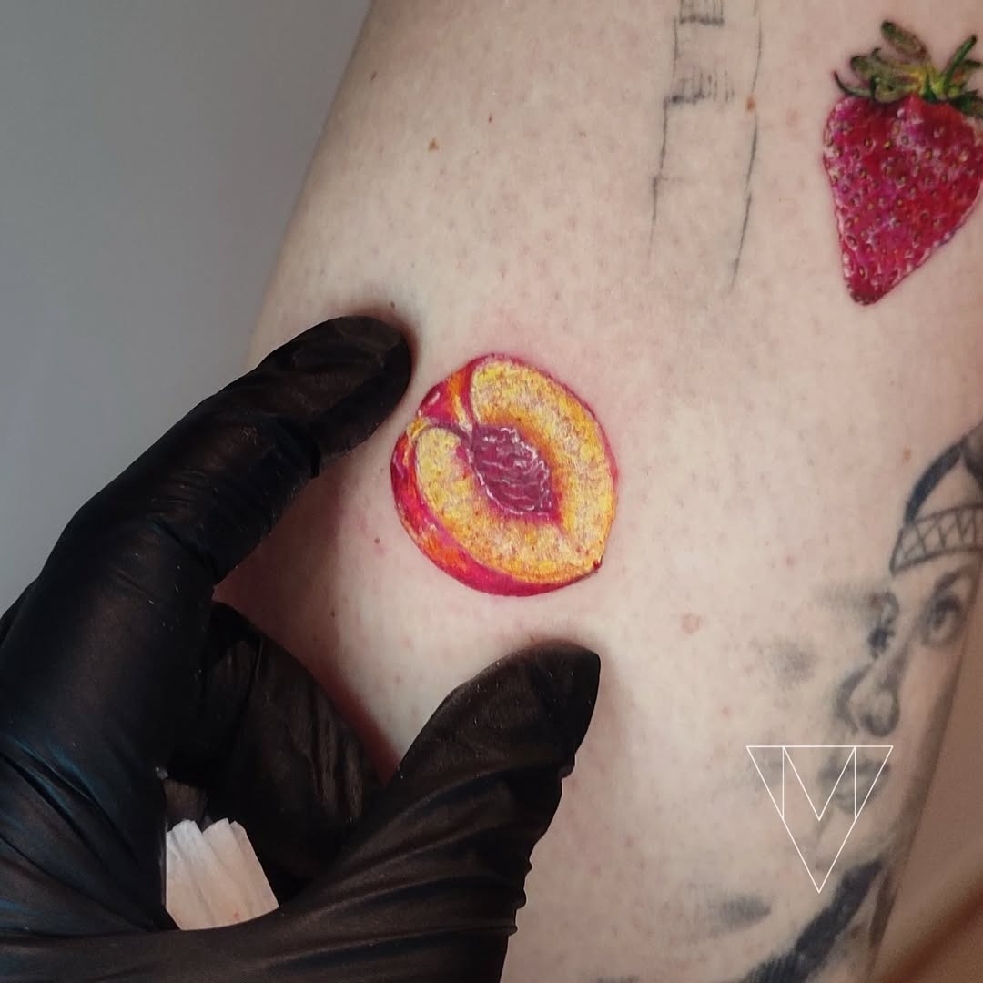 Vivid peach tattoo radiating fruity charm Tattoo Design