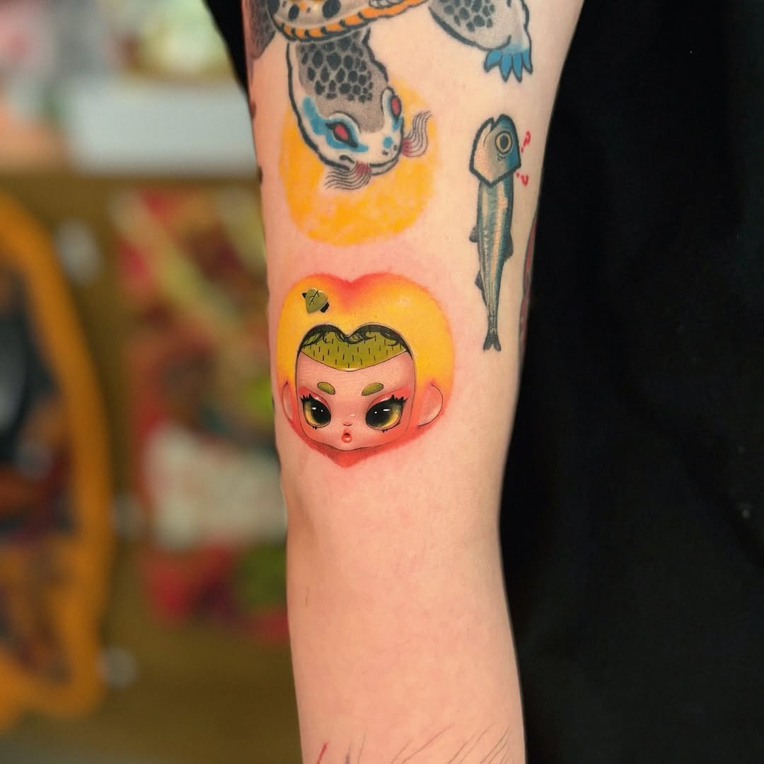 Whimsical peach tattoo with a playful design Tattoo Design