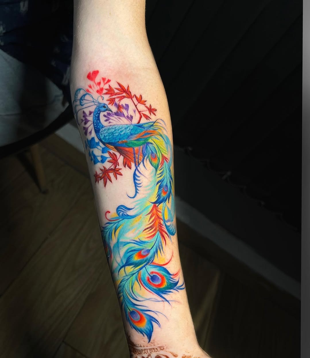 Colorful peacock tattoo with vibrant feathers Tattoo Design