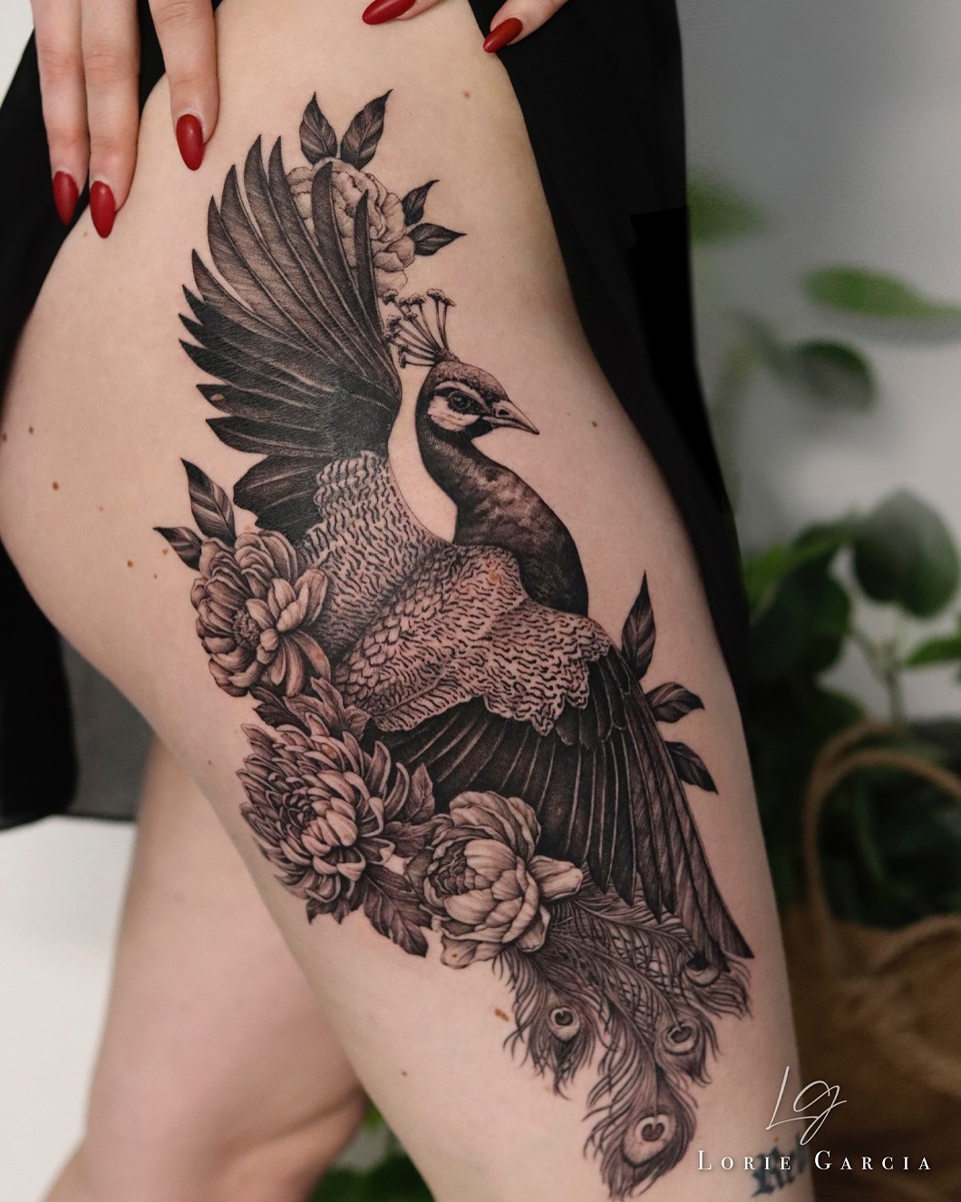 Intricate peacock tattoo with floral elements Tattoo Design