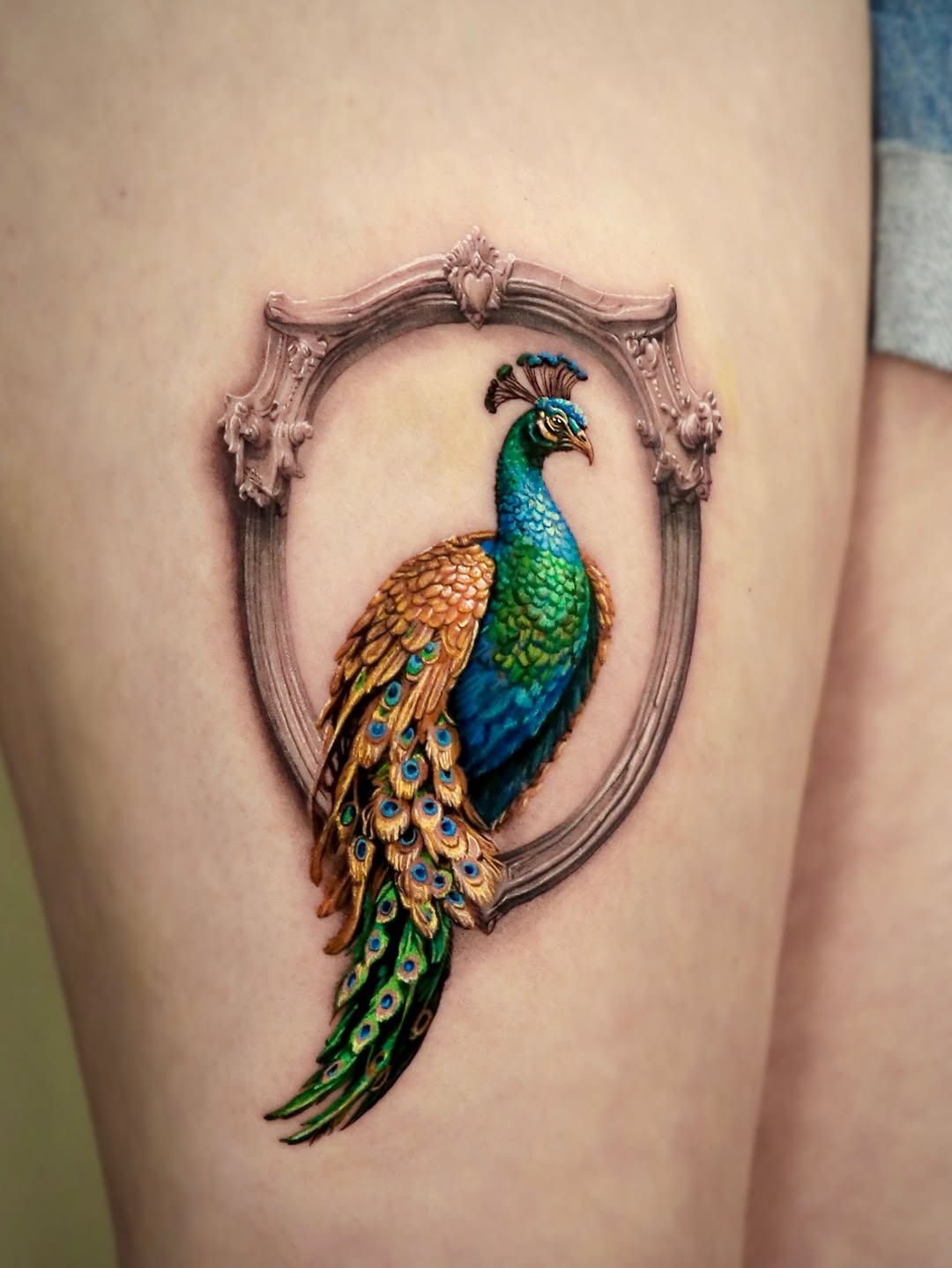 Stunning 3D Peacock Tattoo with Frame Tattoo Design