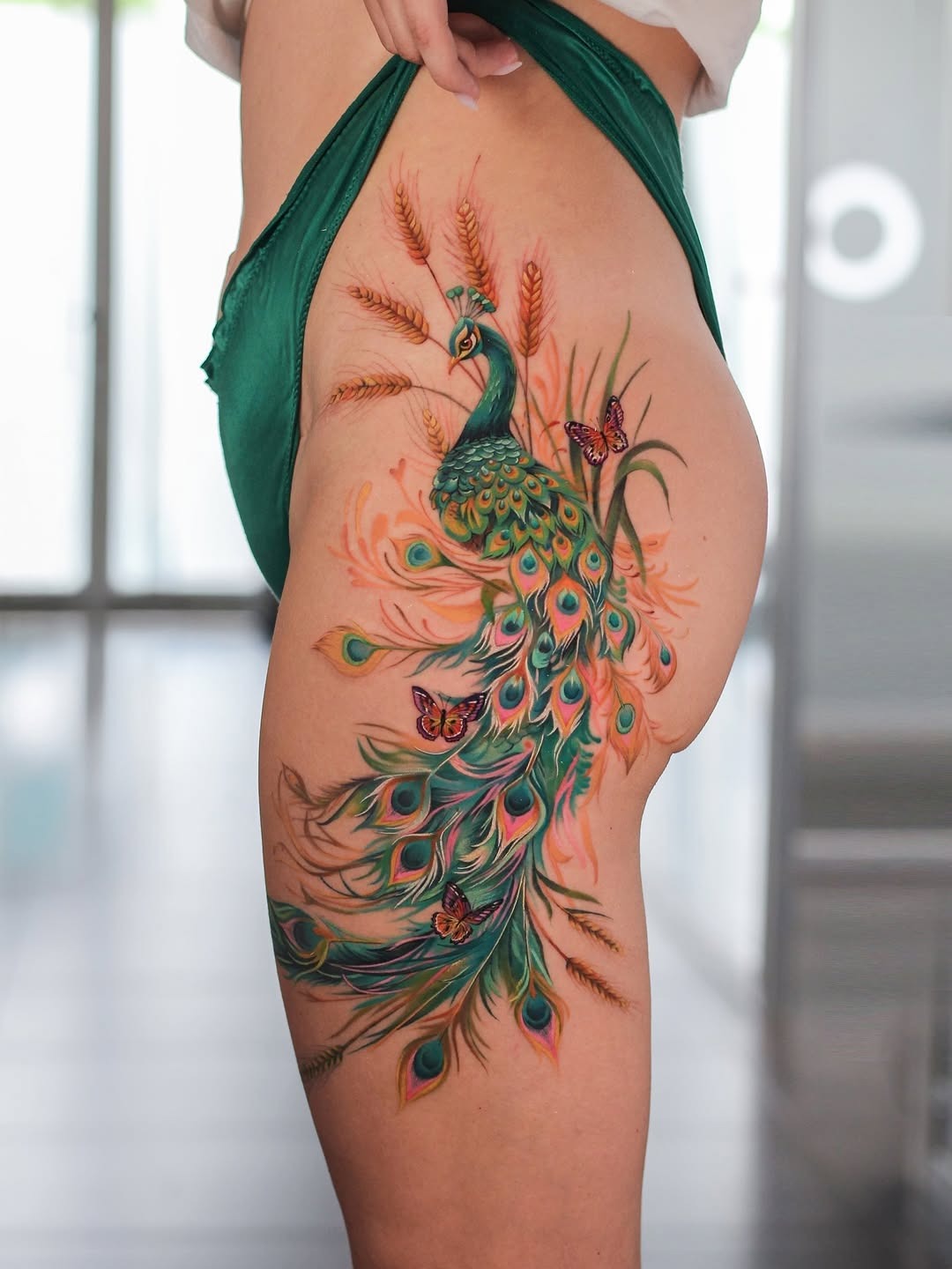 Stunning peacock tattoo showcasing vibrant colors Tattoo Design