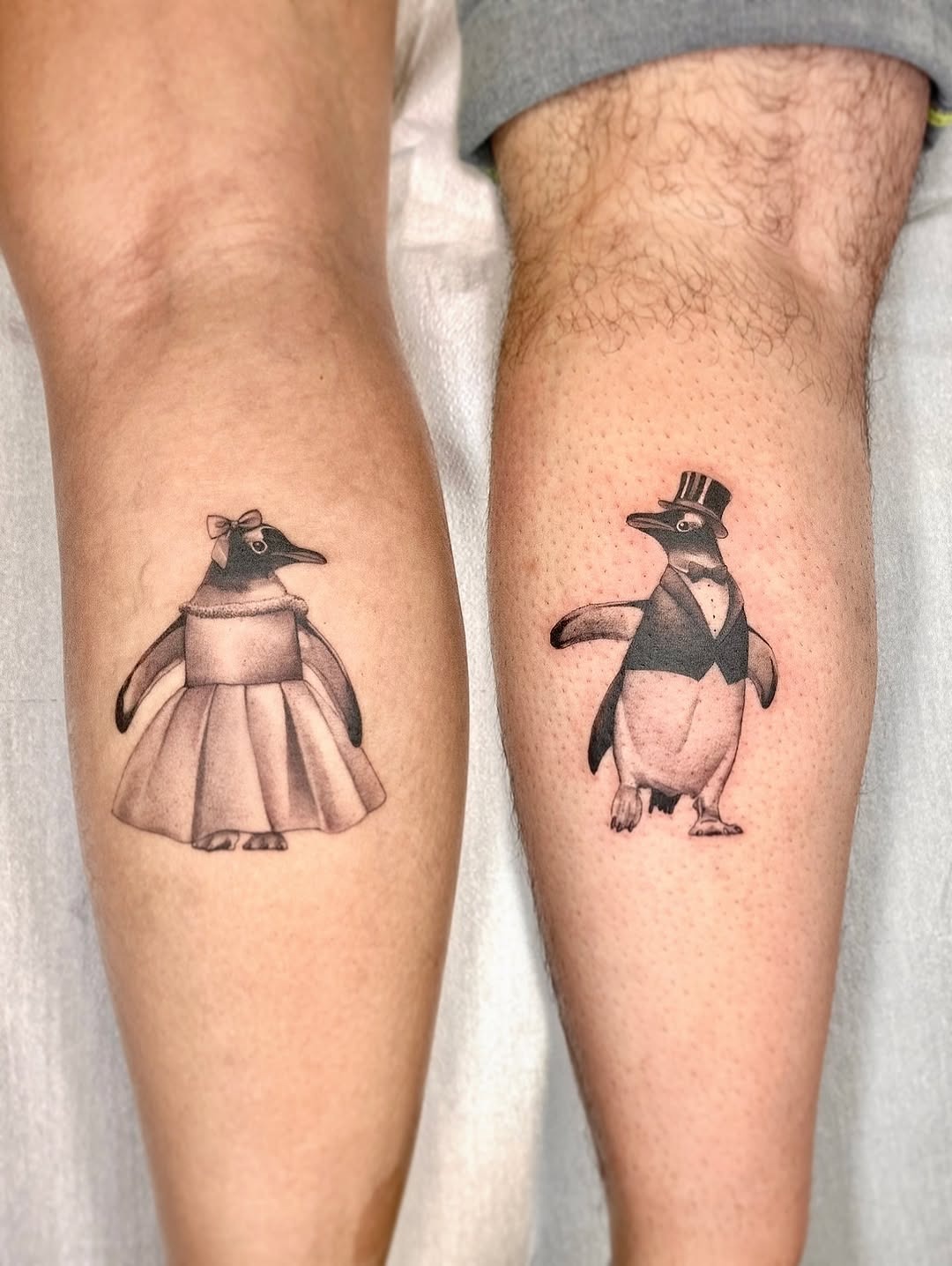 Charming couple tattoos featuring stylish penguins Tattoo Design