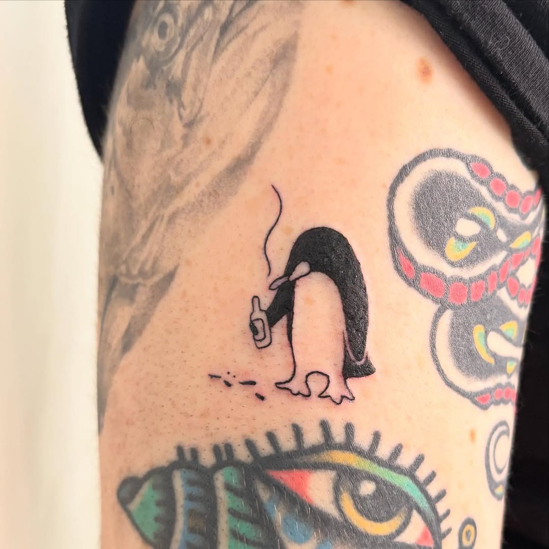 Charming penguin tattoo with a unique twist Tattoo Design
