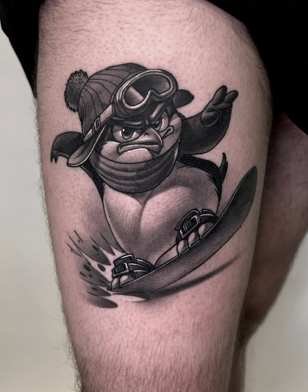 Dynamic penguin tattoo showcasing winter fun Tattoo Design