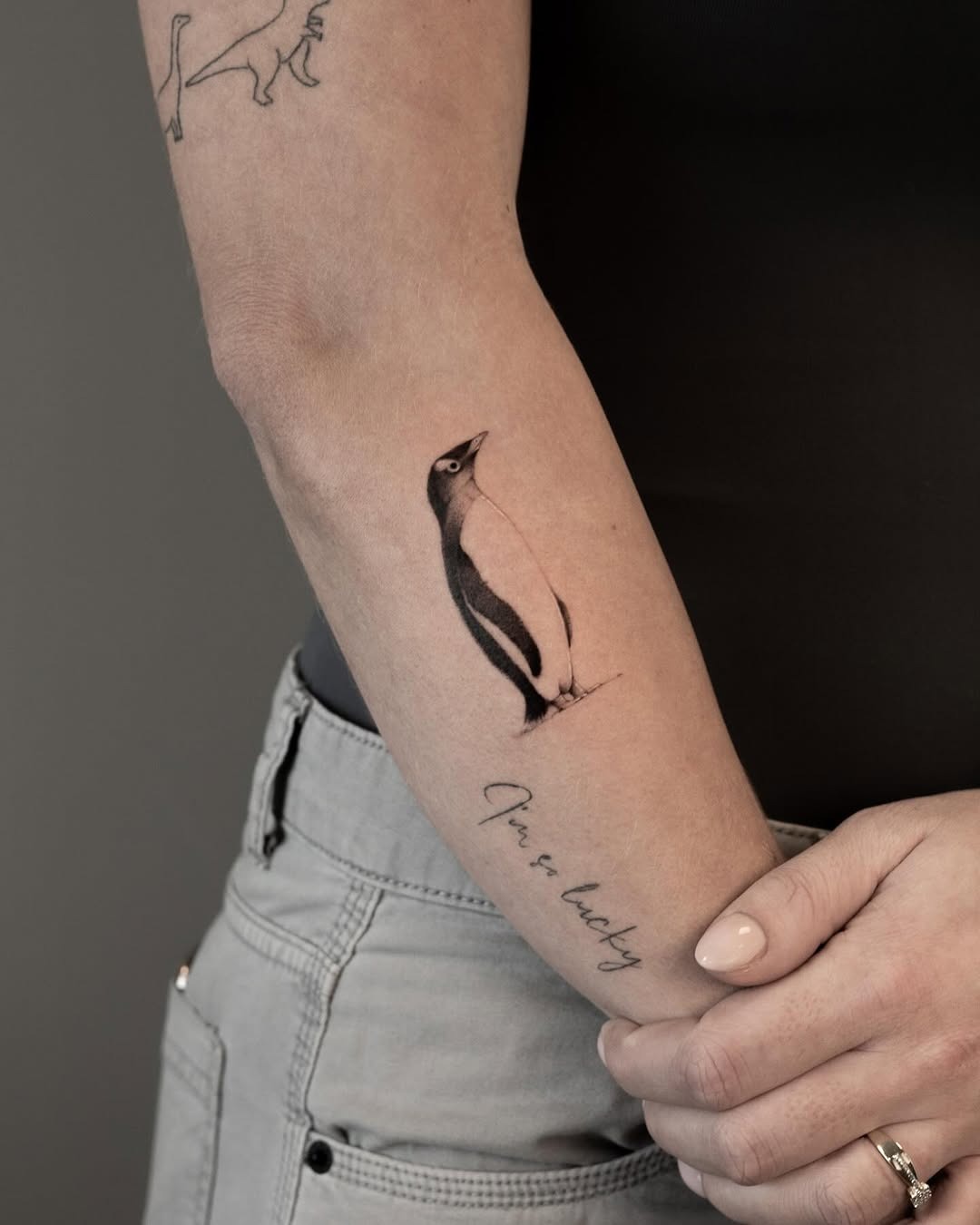 Elegant realism in a penguin tattoo design Tattoo Design