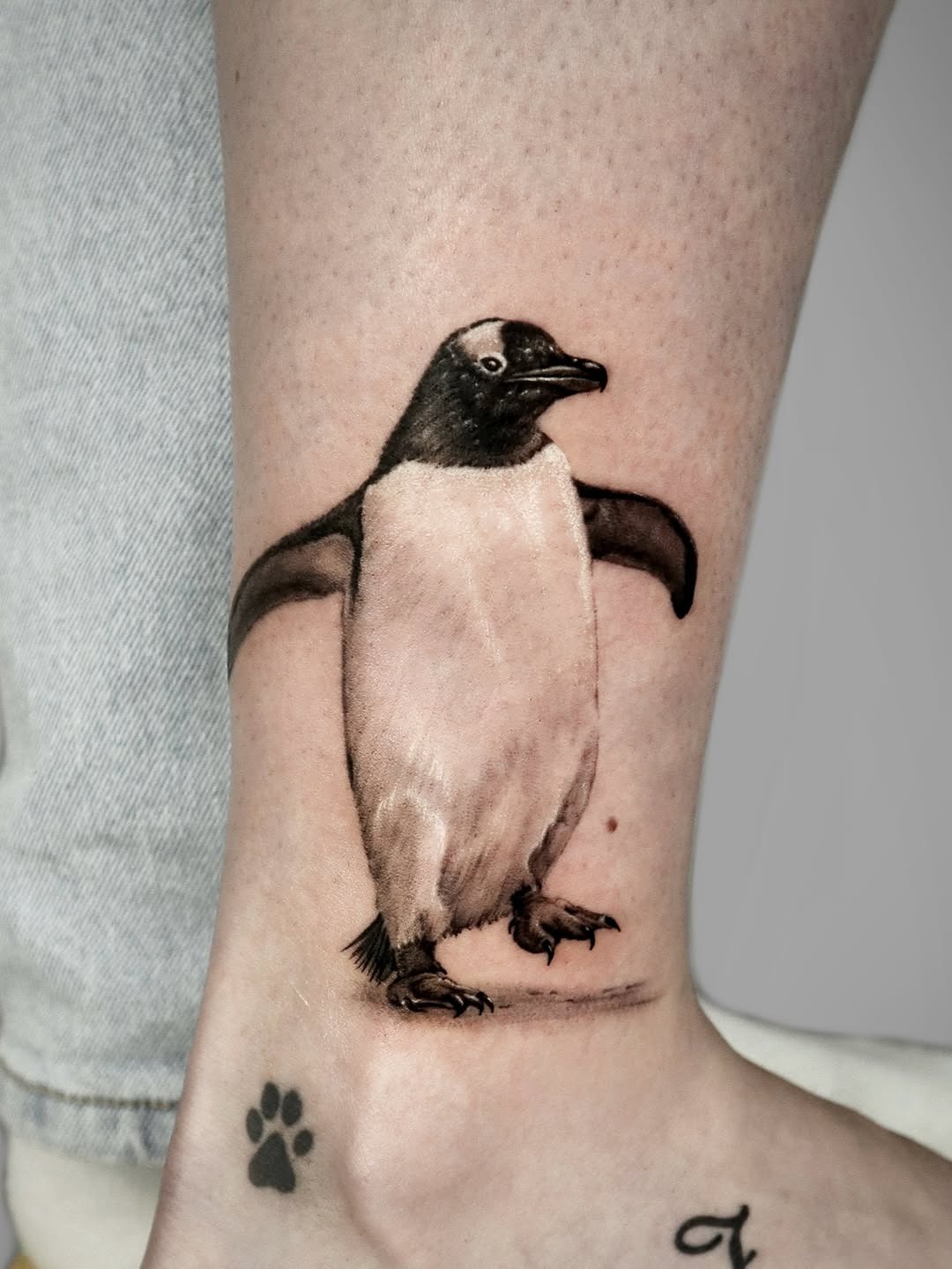 Stylish penguin tattoo with realistic details Tattoo Design