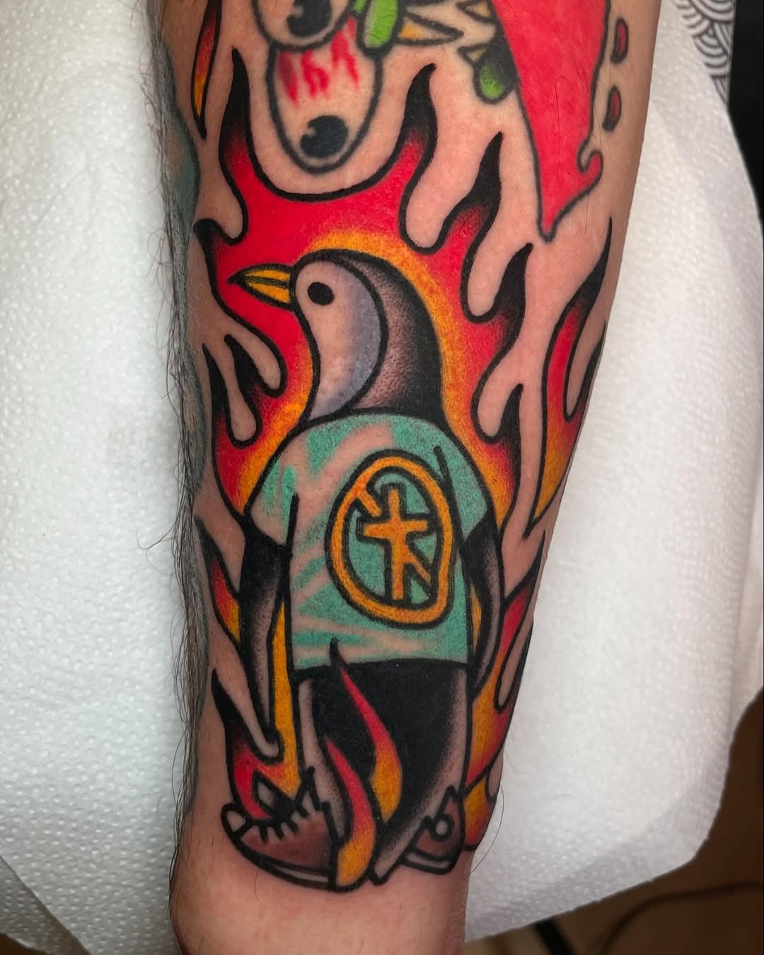 Vibrant Penguin Tattoo with Flames and Style Tattoo Design