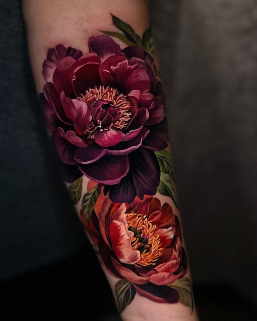 Bold Red Peony Head Tattoo with Green Leaf Accents Tattoo Design
