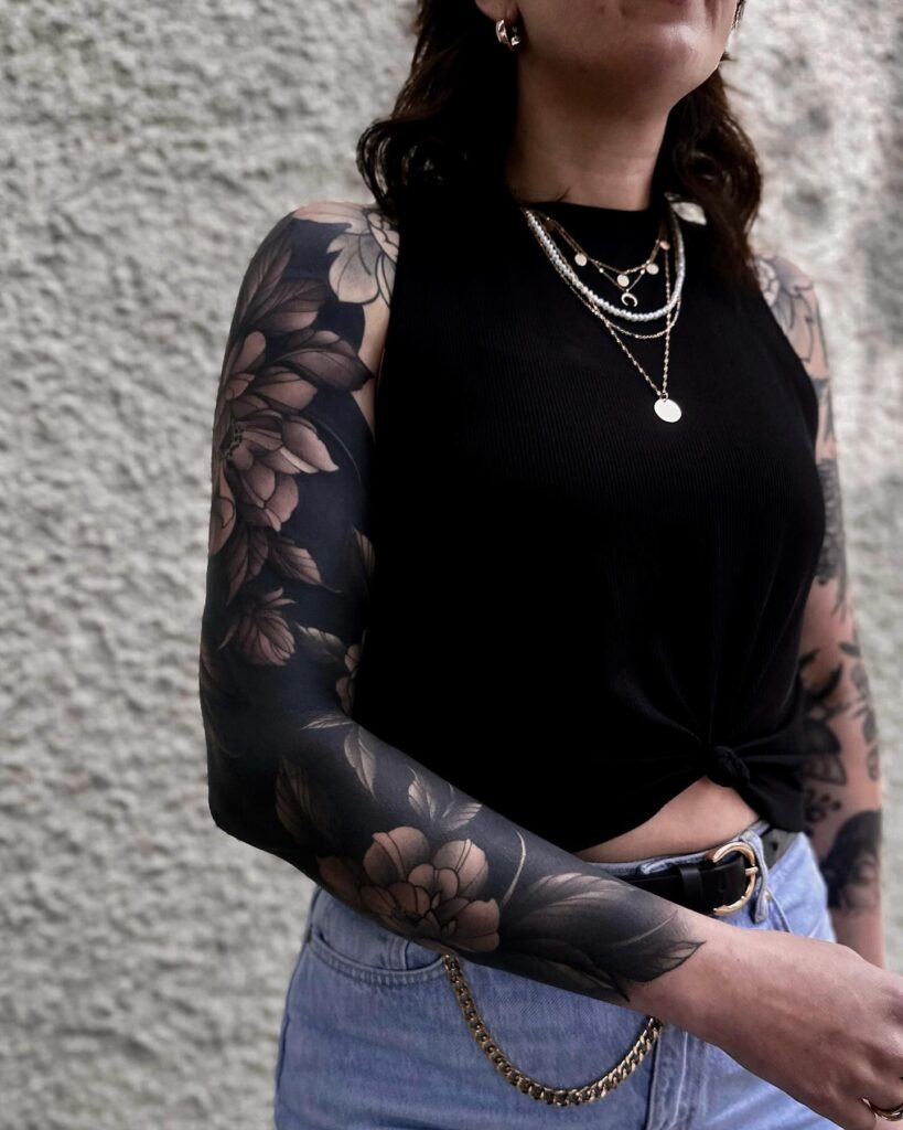 Ornate Peony Tattoo with Bold Leaf Accents Tattoo Design