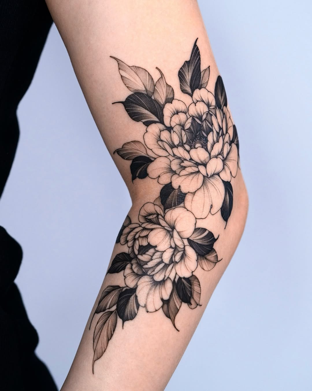 Elegant blackwork peony tattoo on elbow Tattoo Design