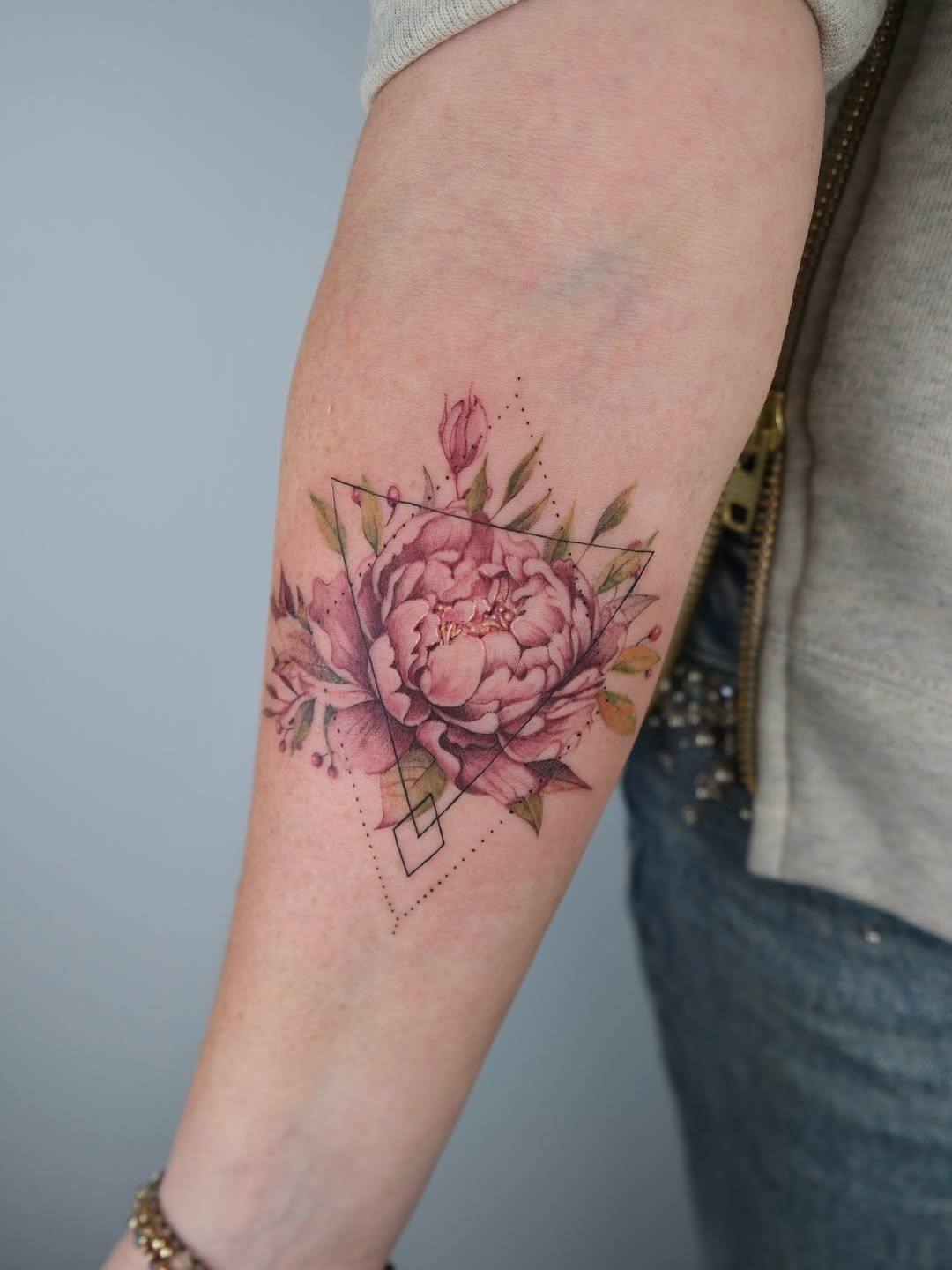Elegantly crafted peony tattoo with geometric elements Tattoo Design