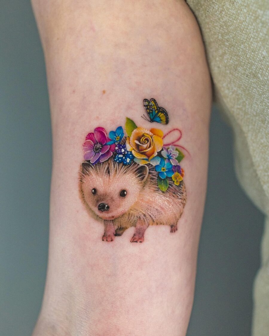 Cute hedgehog tattoo adorned with flowers Tattoo Design
