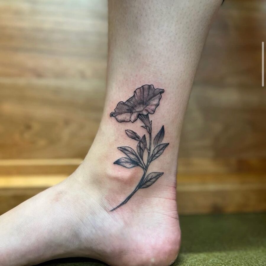 Elegant petunia tattoo gracing the ankle Tattoo Design