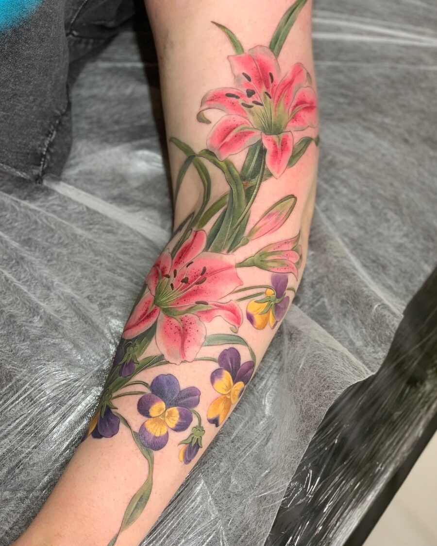 Stunning petunia and lily tattoo in vibrant colors Tattoo Design