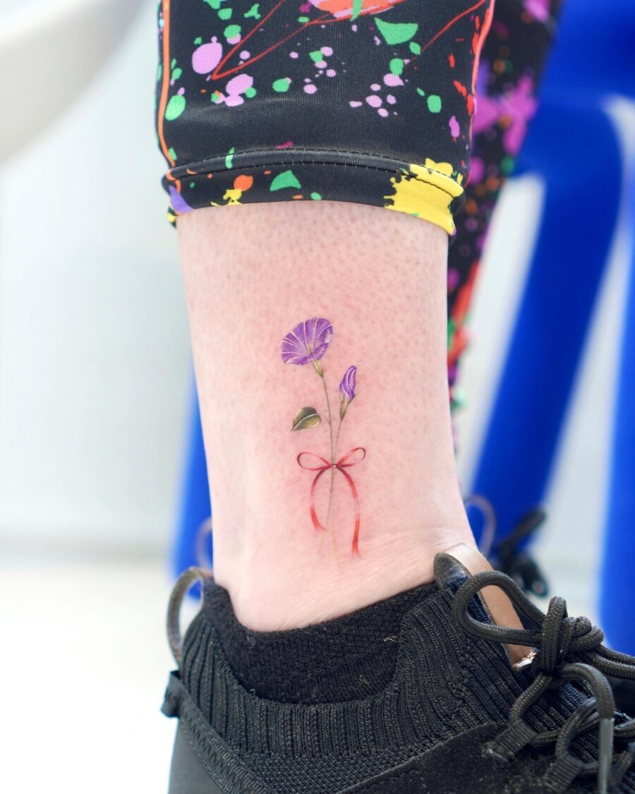 Vibrant Petunia Tattoo with Bow Detailing Tattoo Design