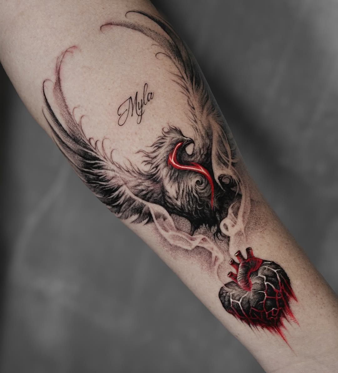 Artistic phoenix tattoo with a heart motif Tattoo Design