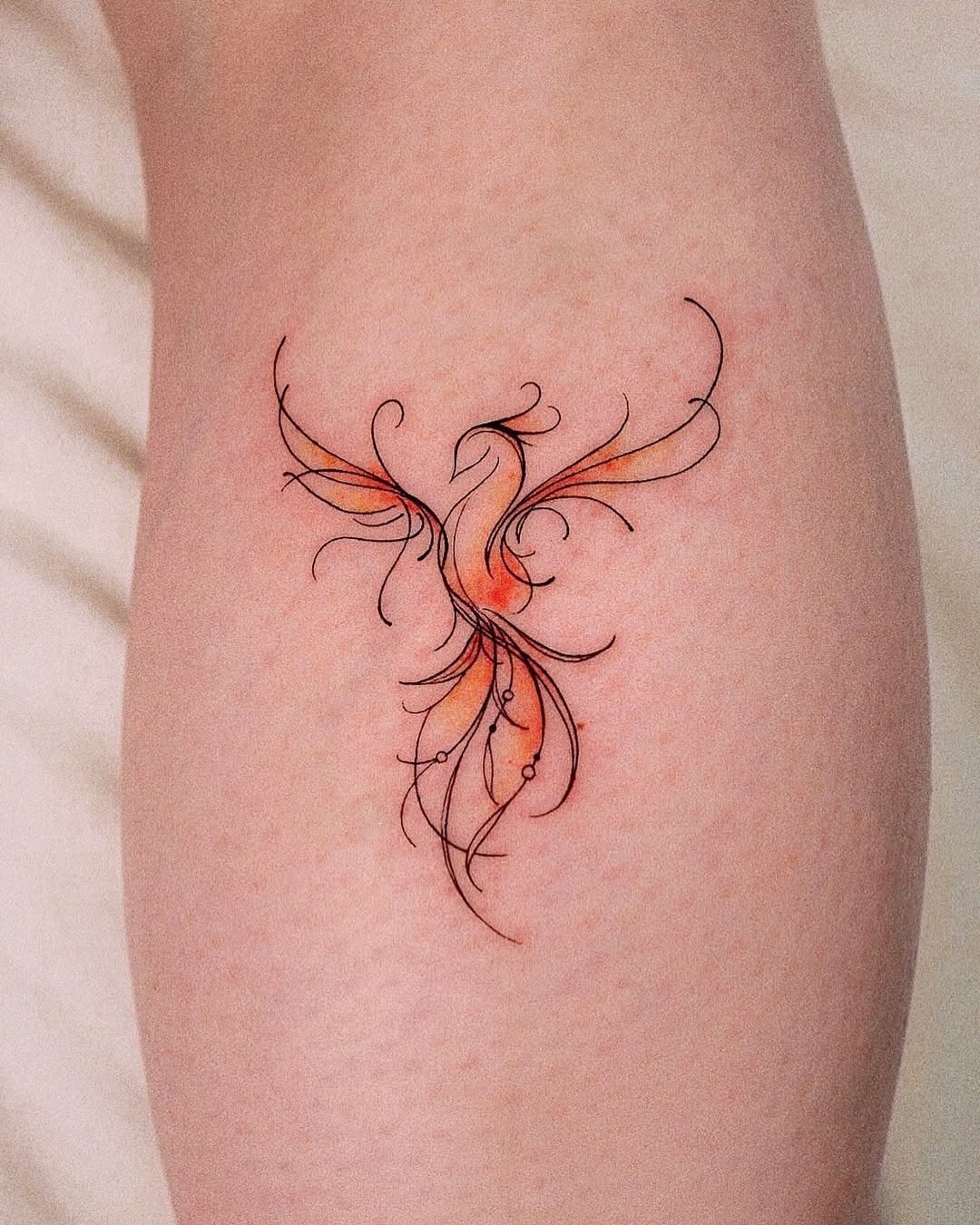 Artistic Phoenix Tattoo with Flowing Lines Tattoo Design