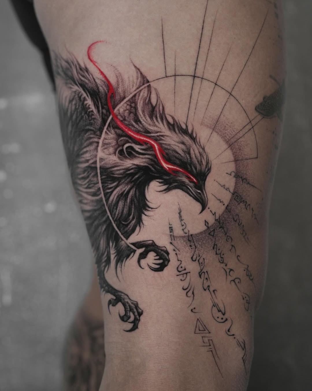 Bold phoenix tattoo with striking red details Tattoo Design