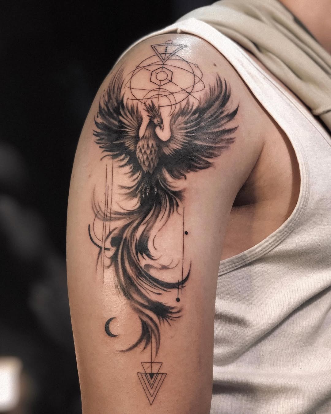 Majestic black phoenix tattoo design on arm Tattoo Design
