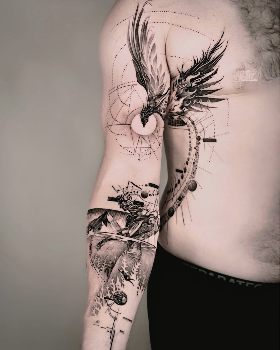 Striking Phoenix Tattoo with Unique Artistic Elements Tattoo Design