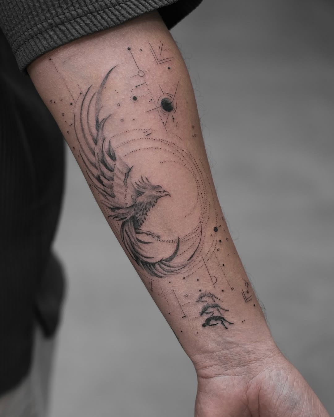 Stunning phoenix tattoo with cosmic elements Tattoo Design