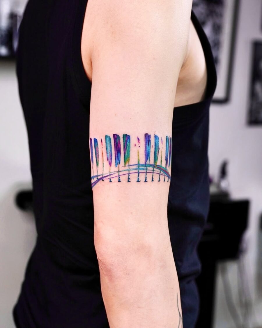 Colorful piano keys tattoo on arm Tattoo Design