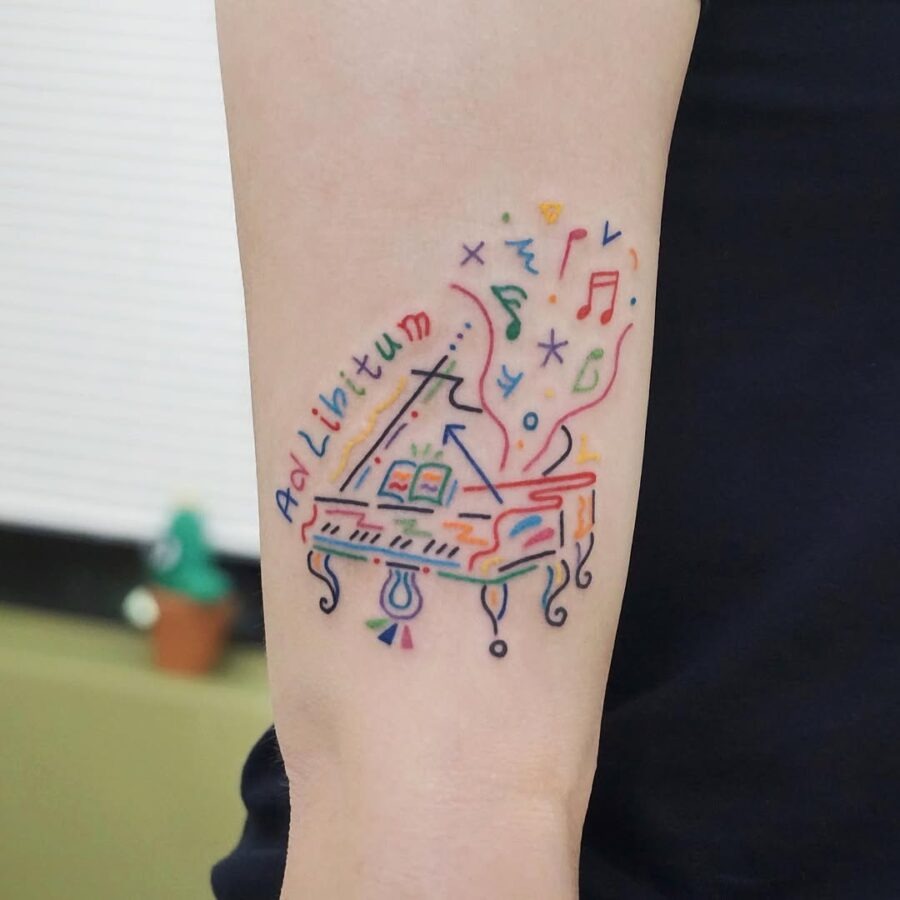 Colorful piano tattoo with musical elements Tattoo Design