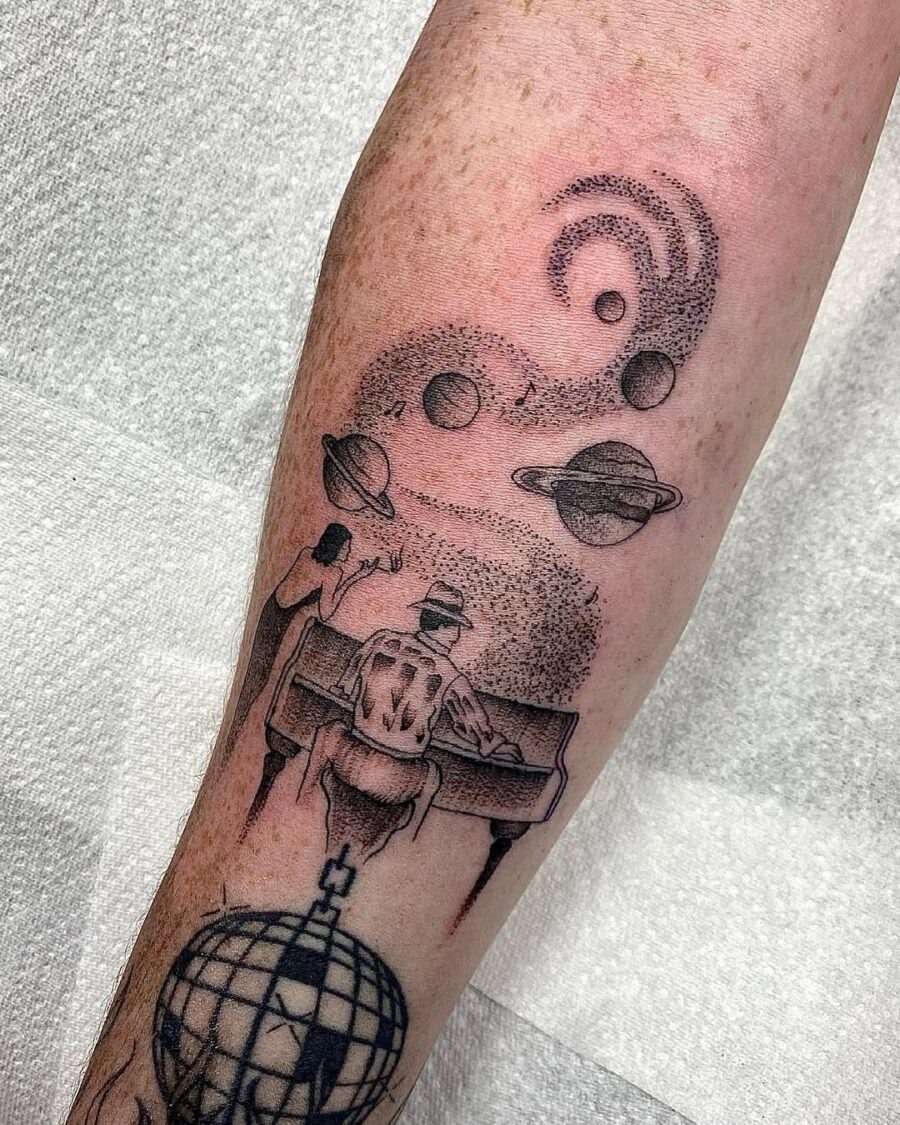 Cosmic piano tattoo blending art and music Tattoo Design